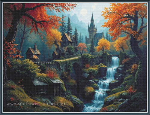 A fantasy landscape full coverage cross stitch showing a small village with cottages, a tall spired castle, autumn trees with vivid orange and yellow foliage, a rocky stream with waterfalls, and misty blue mountains in the background.