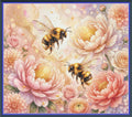 A square floral artwork featuring two bees flying among large pink and peach flowers on a soft pastel background, framed by a blue border.