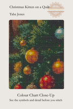 A close-up color chart from a diamond painting or cross-stitch pattern booklet, titled 'Christmas Kitten on a Quilt' by Tabz Jones. The chart shows a pixelated mosaic of a Christmas tree with green needles, warm yellow and orange ornaments, and a small blue ornament, on a light beige background with text and a floral logo.