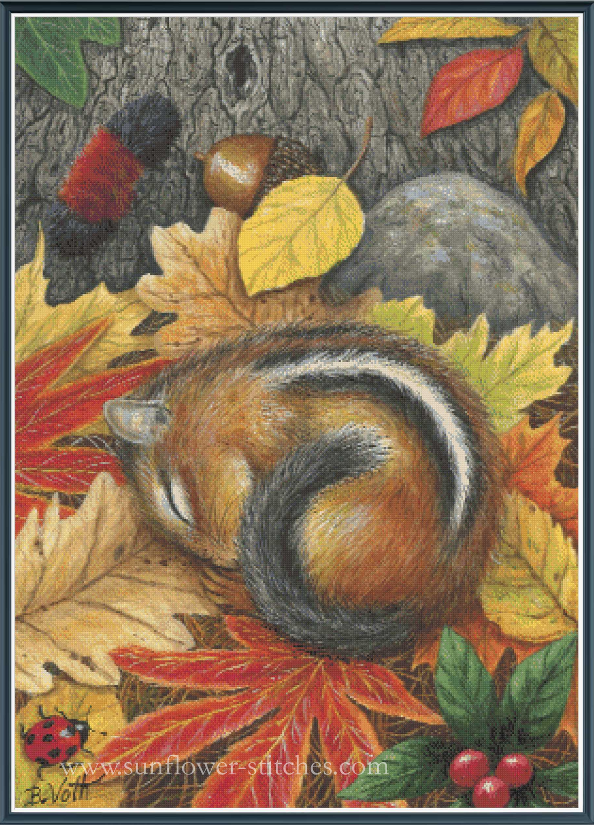 A cross stitch pattern cover featuring a sleeping chipmunk curled up among colourful autumn leaves, acorns, a tree trunk, and a rock. 