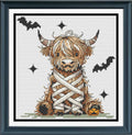 Mummy Highland cow Halloween counted cross-stitch pattern PDF featuring a cute cow wrapped in bandages with bats and a pumpkin, by Sunflower Stitches.