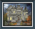 A framed Halloween-themed needlework or art print featuring a haunted Victorian house at night, with pumpkins, bats, ghosts, and the text 'Sunflower Stitches' in the lower right corner.