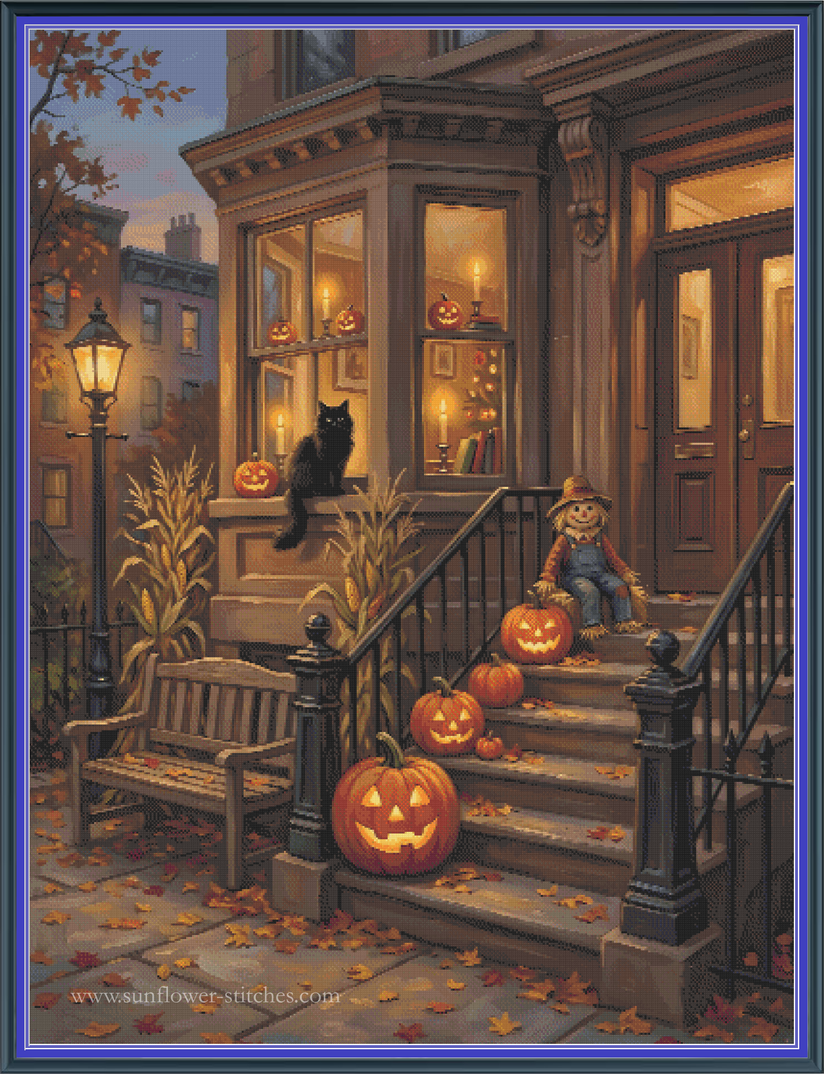 A Cross Stitch mock-up featuring a Halloween street scene in front of a brownstone apartment building. A black cat sits on the porch, a scarecrow stands on the steps, and several carved pumpkins line the stairs. 