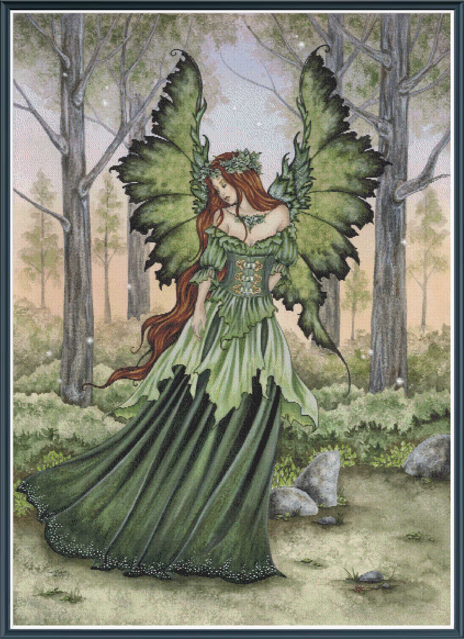 Fairy in a green dress with butterfly wings standing in a forest setting