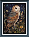Framed cross stitch featuring a barn owl perched among wildflowers under a starry night sky. The artwork is presented in a dark teal frame with white matting.