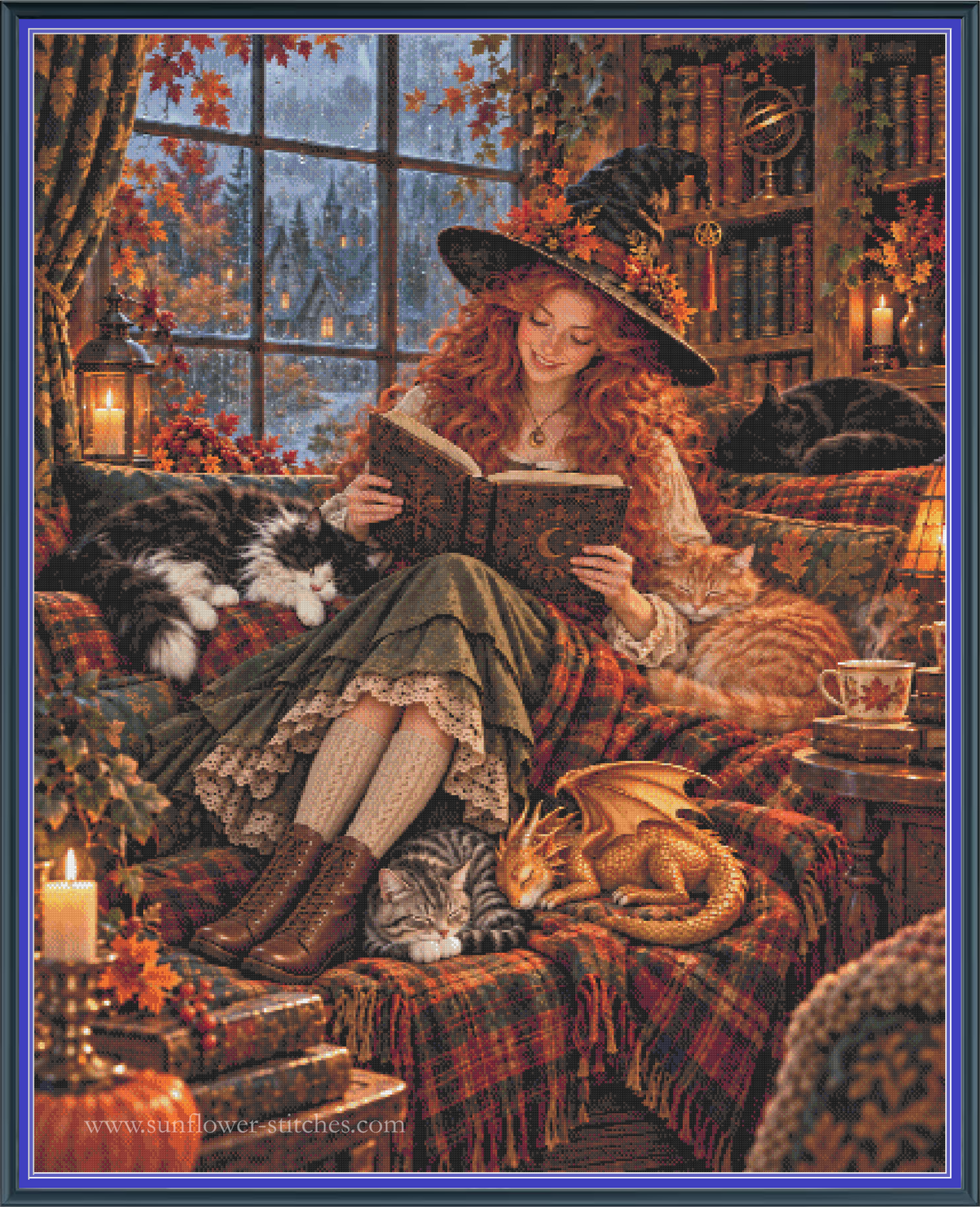 A cross stitch mock-up featuring a cozy  scene of a witch with long red hair sitting in a plaid armchair and reading a book, surrounded by cats, autumn leaves, candles, and bookshelves. The artwork is framed by a blue border, and the text 'www.