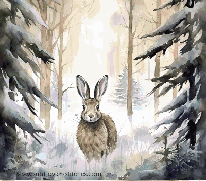Watercolor-style cross stitch of a brown hare standing in a snowy forest with bare trees and dark snow-covered branches on both sides. 