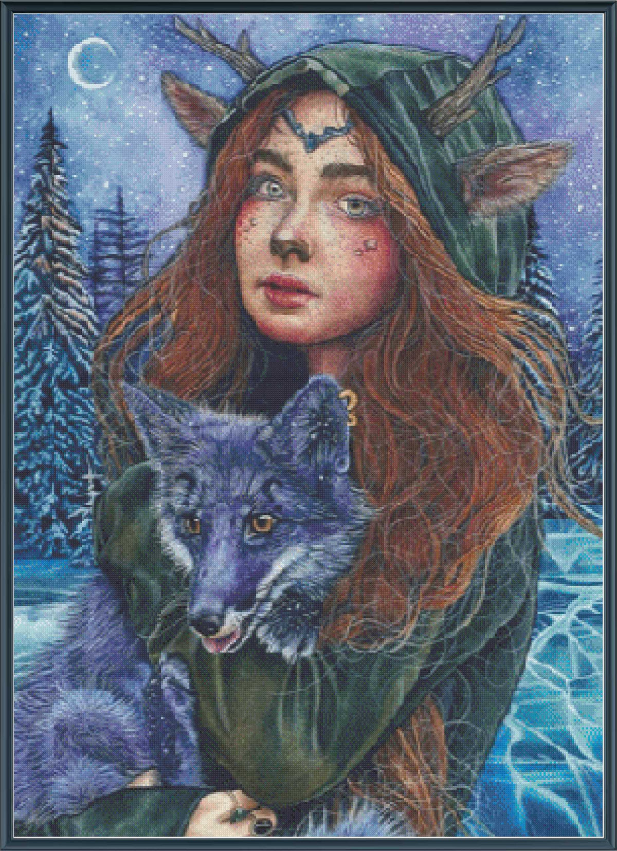 A fantasy-style cross stitch of a woman with long red hair, deer-like antlers, and a green hooded cloak holding a blue-gray wolf in a snowy night scene with pine trees and a crescent moon.
