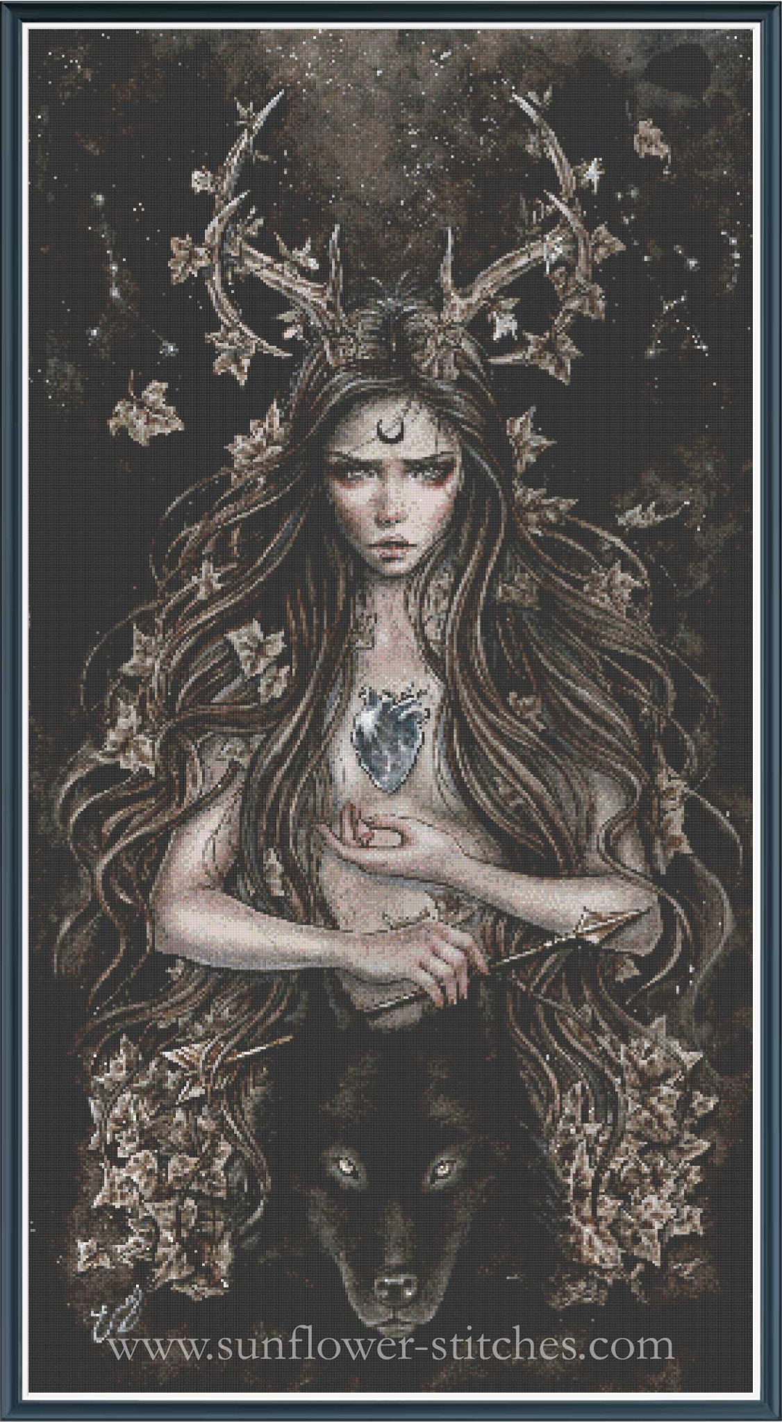 Fantasy cross-stitch design featuring a female goddess with long hair, antler crown, moon symbol on forehead, heart on chest, and a wolf at her feet.