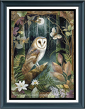 A framed cross stitch featuring a detailed illustration of a barn owl perched on a branch in a lush forest, surrounded by leaves, flowers, and a butterfly. The print is presented in a dark wood frame with a white mat.