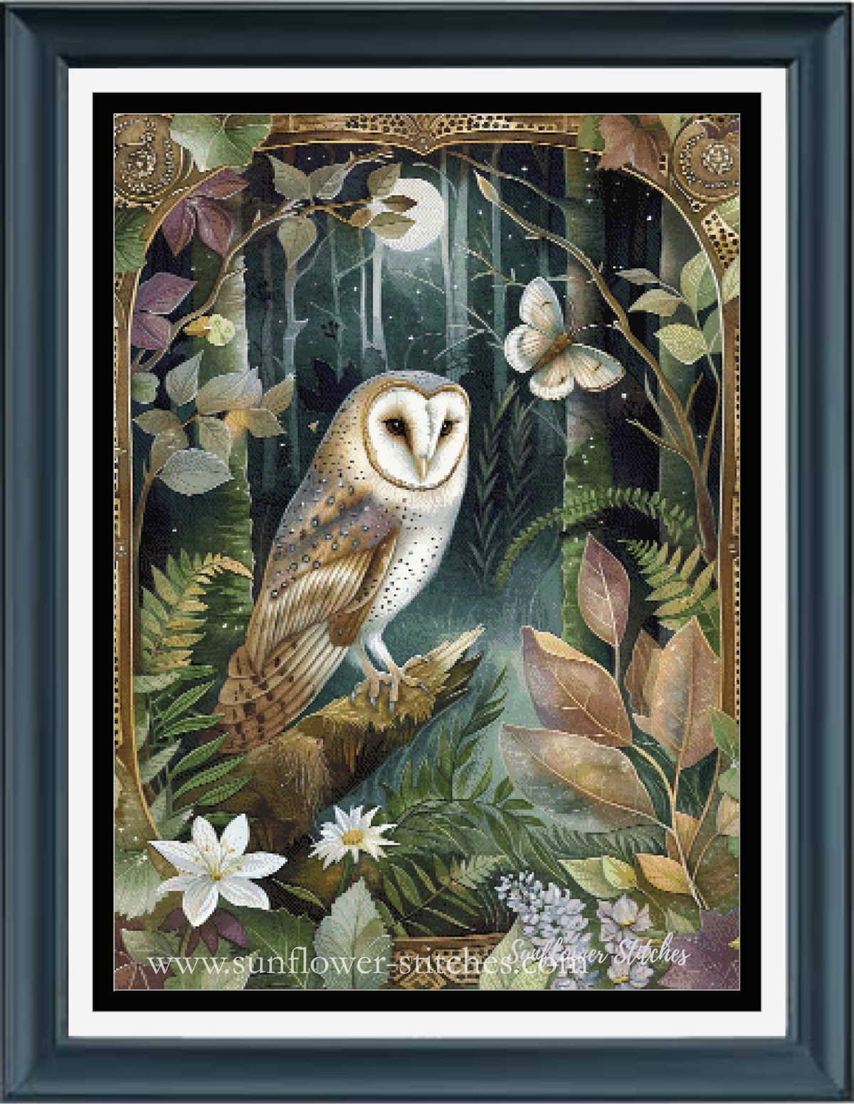 A framed cross stitch featuring a detailed illustration of a barn owl perched on a branch in a lush forest, surrounded by leaves, flowers, and a butterfly. The print is presented in a dark wood frame with a white mat.