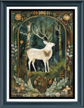 Framed cross stitch featuring a white deer with antlers standing in a dark forest, surrounded by botanical details and butterflies, presented in a dark frame with white matting.