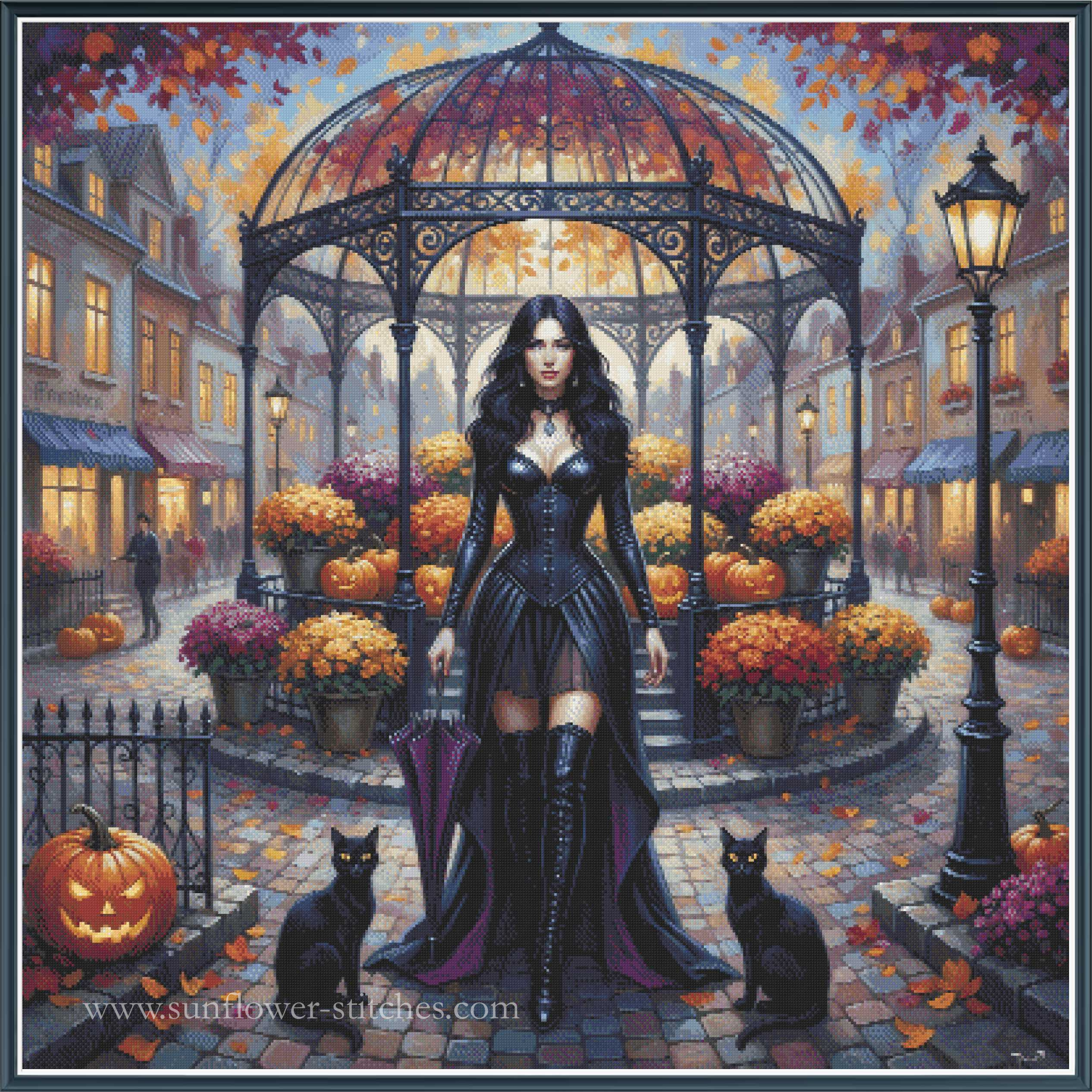 Gothic fantasy cross stitch of a woman in a black corset and thigh-high boots standing in a cobblestone street under an iron gazebo, surrounded by pumpkins, orange flowers, black cats, and autumn leaves.