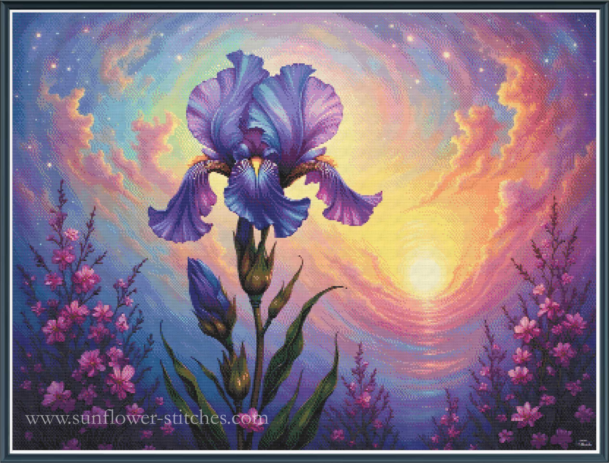 A full coverage cross stitch mock up depicting a large purple and blue iris flower in the center, surrounded by pink wildflowers and a swirling sunset sky with yellow, orange, and purple hues.