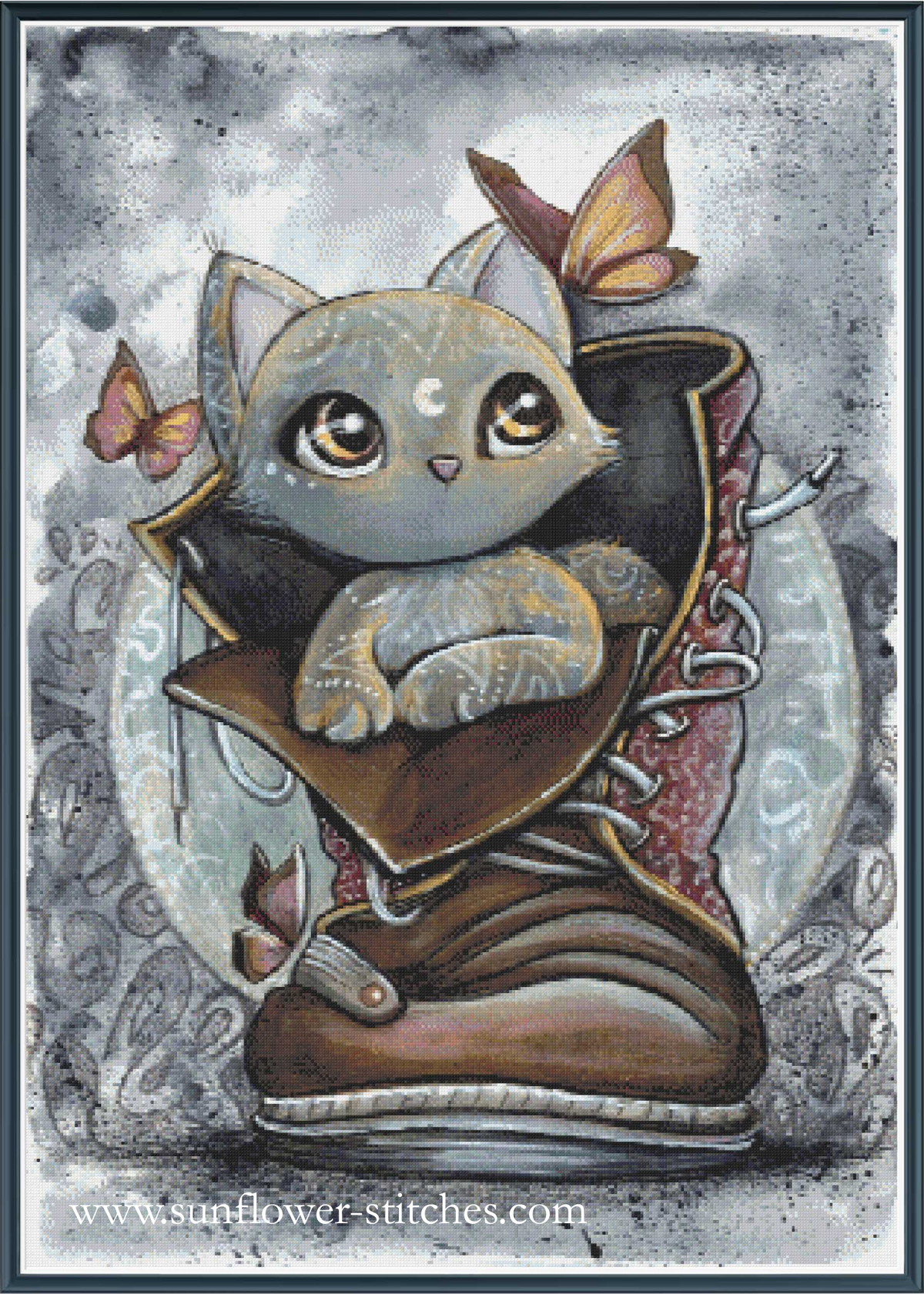 A whimsical cross stitch of a small gray cat nestled inside a large brown boot, with butterflies around it and a textured gray background.